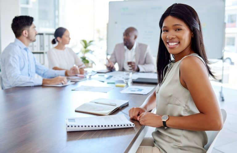 Happy black woman, leadership or business leader in meeting for teamwork, diversity or team buildin